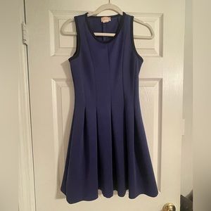 Blue pleated dress with black piping